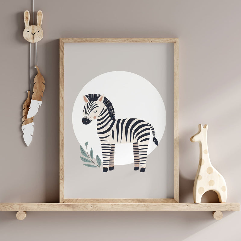 Set of three A4 prints featuring minimalist illustrations in muted tones. Each print depicts a different animal: a lion, a zebra, and a giraffe. The background is tan coloured with a white circle on which the animal is overlaid.