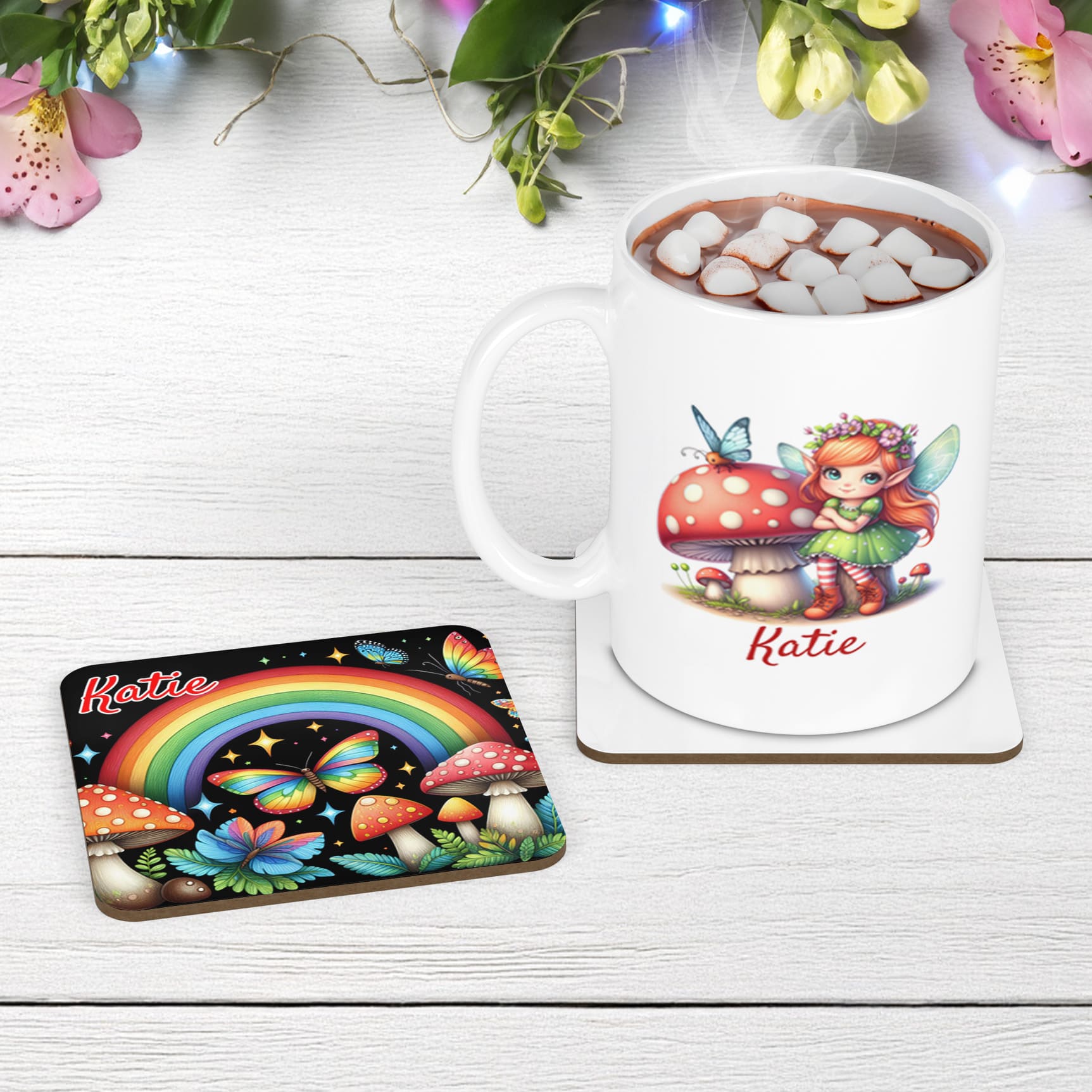 Fairy Garden mug and coaster set. Multicoloured rainbows, butterflies and toadstools pops on the black coaster, while the while mug features a winged fairy. Both items personalised with name of your choice