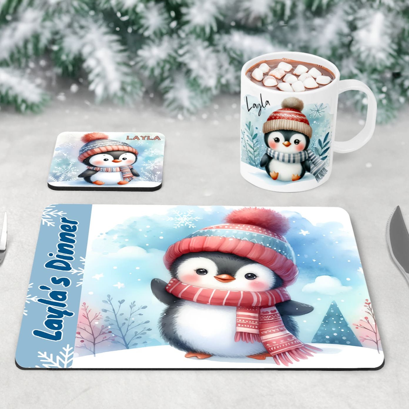 Personalised Mug, Coaster and Placemat set for Childrens Christmas. Featuring soft, adorable penguins dressed in hats and scarves and customised with childrens name