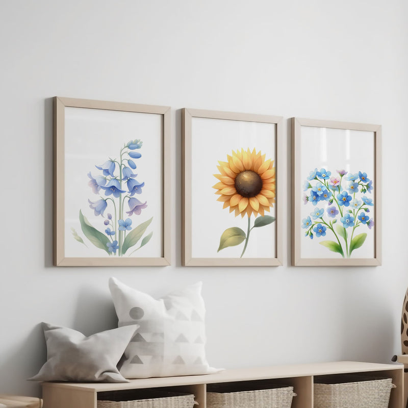 Three botanical prints with soft pastel illustrations of a sunflower, bluebell, and forget-me-not, perfect for a delicate, nature-inspired decor.
