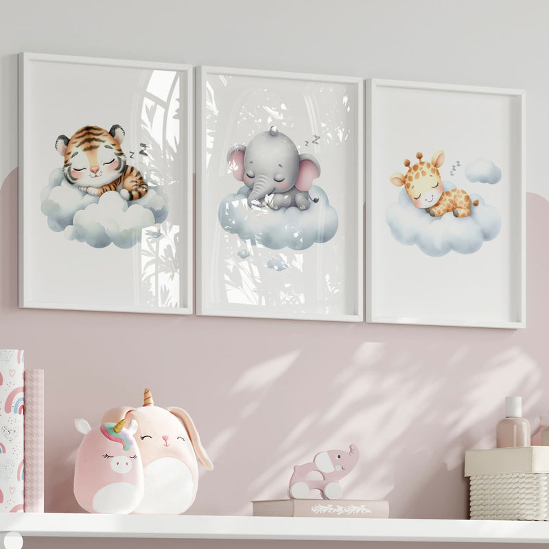 Set of three A4 prints in watercolour style. The first print shows a baby tiger sleeping on a cloud, the second depicts a baby elephant sleeping on a cloud, and the third features a baby giraffe sleeping on a cloud.