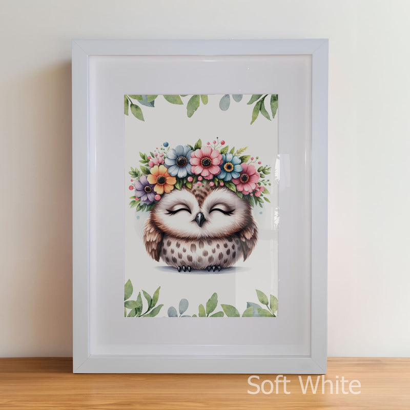 Framed artwork of an owl with a floral headband on a white background