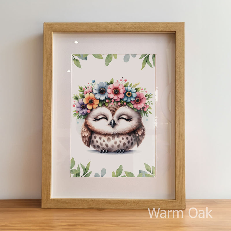 Framed artwork of an owl with a floral headband on a light background