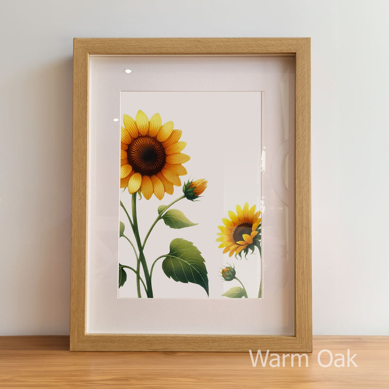 Framed artwork of sunflowers with a warm oak frame on a light background