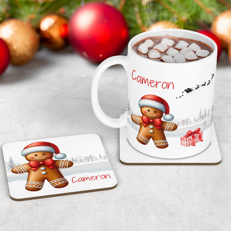 Kids Christmas Table Wear Set. A white mug featuring bright, bold gingerbread man design. Coaster and placemat have similar design on a white background. All personalised with childs name
