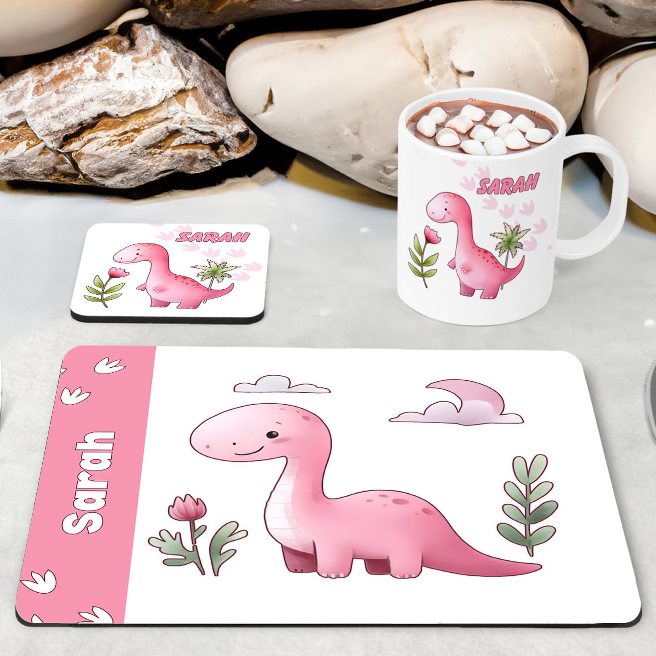 White Placemat, Mug and Coaster Set with Cute friendly pink dinosaur , flower and dinosaur prints. Personalised with Childs name