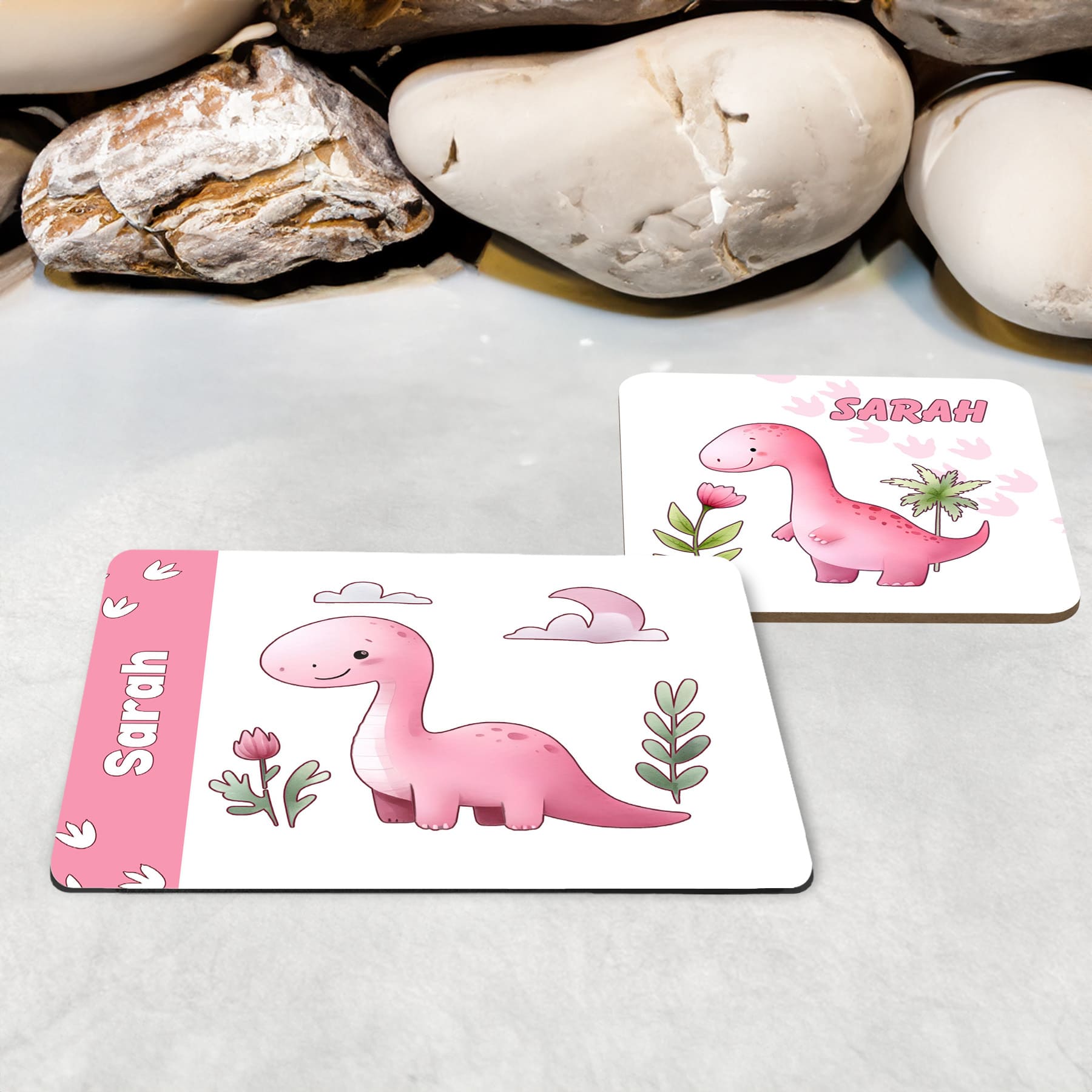 White Placemat and Coaster Set with Cute friendly pink dinosaur , flower and dinosaur prints. Personalised with Childs name