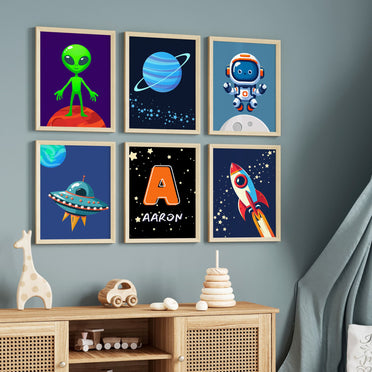 Set of Six A6 Prints. All in dark shades of blue & black showing various space themed images - ei alien, rocket, astronaut. Simple design suited for young children. One print is personalised with Childs name and initial