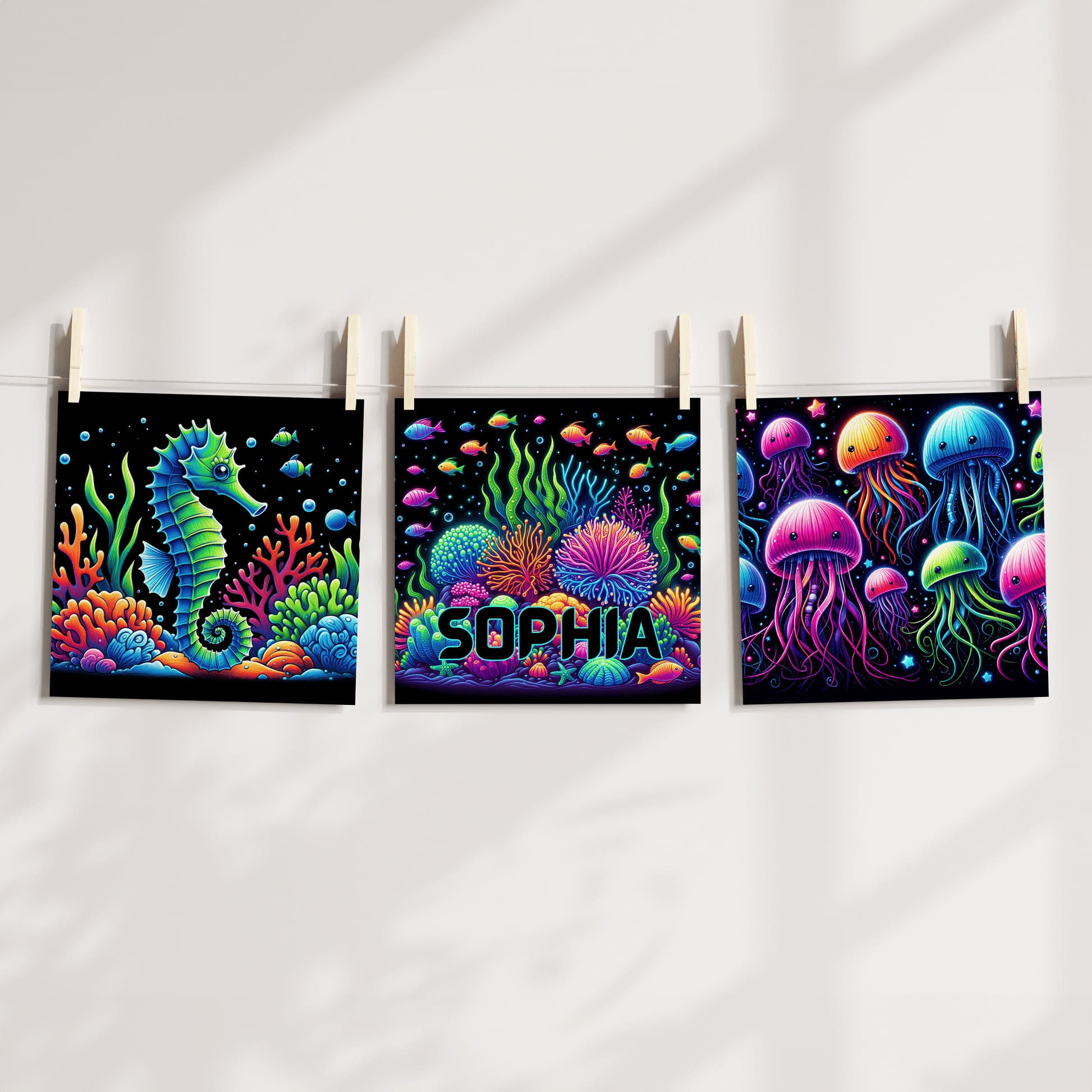 Set of 3 square nursery prints. A neon underwater design featuring seahorse, coral and jellyfish, on a black background. One print personalised with childs name