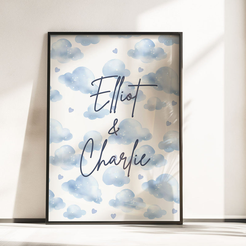 Two A4 Prints. One showing 2 cartoon elephants dressed in blue dungarees, one with a bow, one without and reads "BFF Born Forever Friends". The other print has blue watercolour style clouds, with children's name in black writing across it