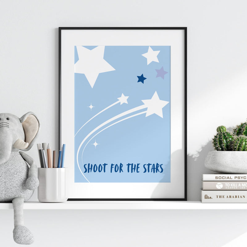 3 Nursery Prints in Blue. One features spotty background with childs initial, one with simple stars on blue background, one with a rocket and childs name