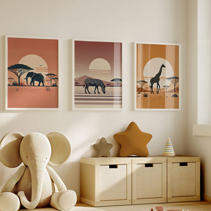 Set of 3 nursery wall prints - an elephant, zebra and giraffe silouettes against rich warm backgrounds - one orange, one ochre and one brown 