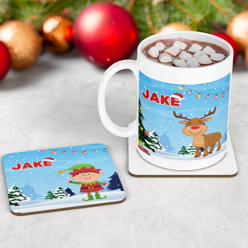 Kids Christmas Mug, Coaster and placement set featuring a bright blue background with christmas trees and santa/elf/reindeer cartoon design. All personalised with childs name