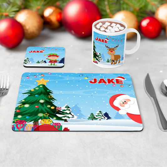 Kids Christmas Mug, Coaster and placement set featuring a bright blue background with christmas trees and santa/elf/reindeer cartoon design. All personalised with childs name