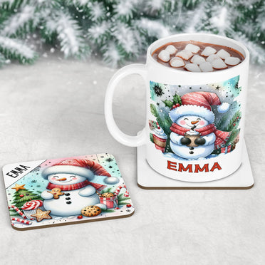 Childrens christmas mug and coaster set. Featuring bright and colourful snowman designs - one drinking hot chocolate and one eating cookies. Personalised with childs name