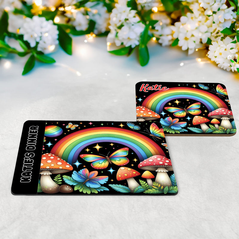 Rainbow coloured bright and bold fairy garden placemat and coaster set. Featuring rainbows, butterflies and toadstools, this multicoloured design pops on its black background, and is personalised with name of your choice