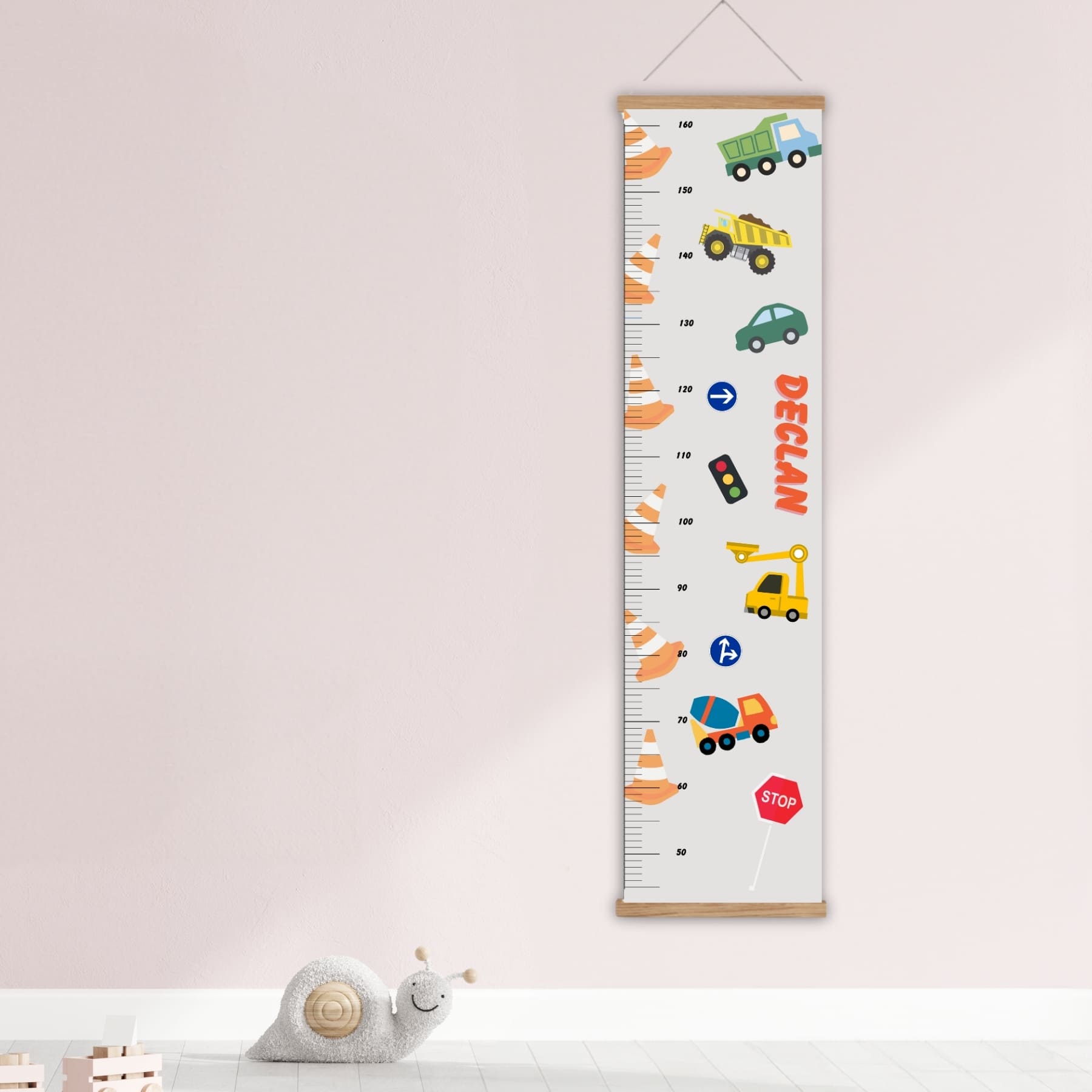 Personalised childs height hart in a neutral colour with cars, trucks, traffic cones and signs. Available on a black, white or natural hanger