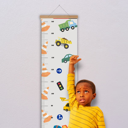 Personalised childs height hart in a neutral colour with cars, trucks, traffic cones and signs. Available on a black, white or natural hanger