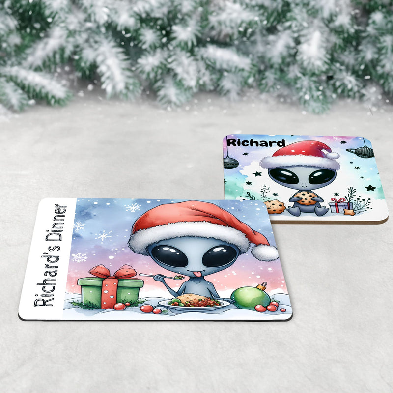 Christmas dinnerware set for kids, personalised with child’s name. Includes custom alien-themed placemat, coaster, and mug. Unique holiday gift idea for children; vibrant colours & fun alien design make it ideal for festive table decor and Christmas