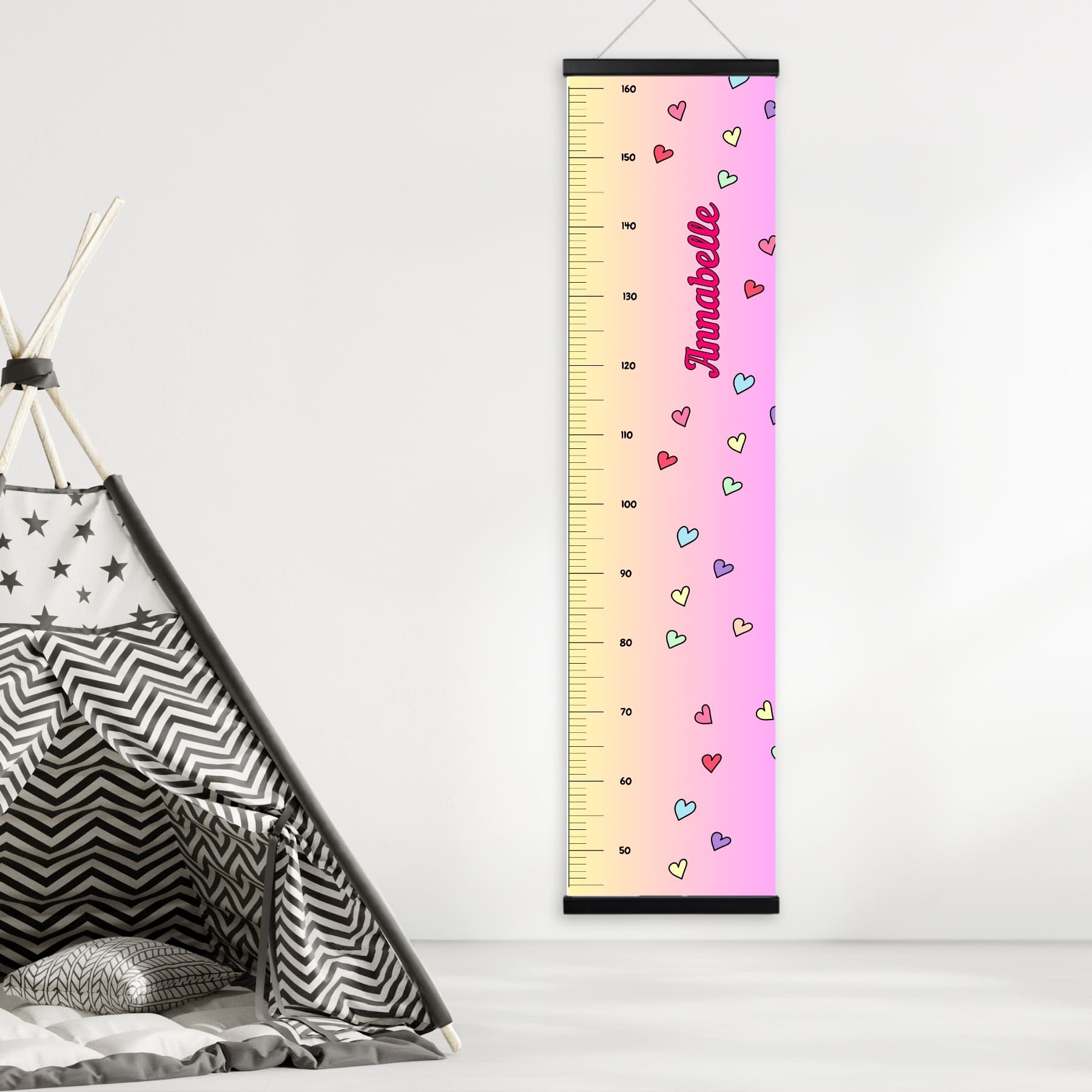 Childs height chart in yellow & pink with colourful love hearts and personalised with your childs name in vibrant pink. Available on black, white or natural hanger