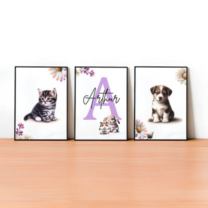 Set of three A4 prints featuring cute pets - puppy, kitten, rabbit, and hamster. The animals are depicted in a cute style resembling coloured pencil drawings. Simple flowers decorate the edges of the prints. The middle print features a smaller animal than the others, with a large initial letter in the background. A personalised name in black overlays the initial letter.