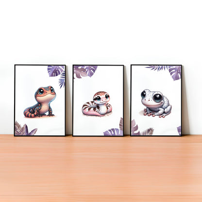 Set of three A4 prints featuring pink/purple reptiles/amphibians - frog, lizard, and snake. The animals are depicted in a cartoony, style resembling coloured pencil drawings in warm shades of pink, purple and orange. Jungle-style leaves in shades of purple decorate the edges of the prints. 