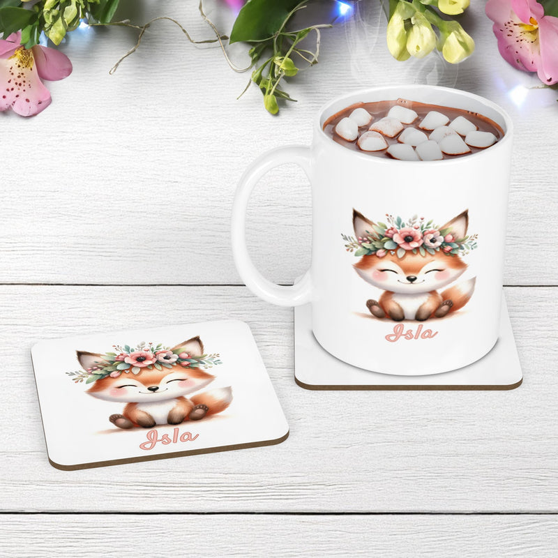 White mug and coaster set with cute woodland fox wearing a flower crown. Personalised with your childs name in pale pink