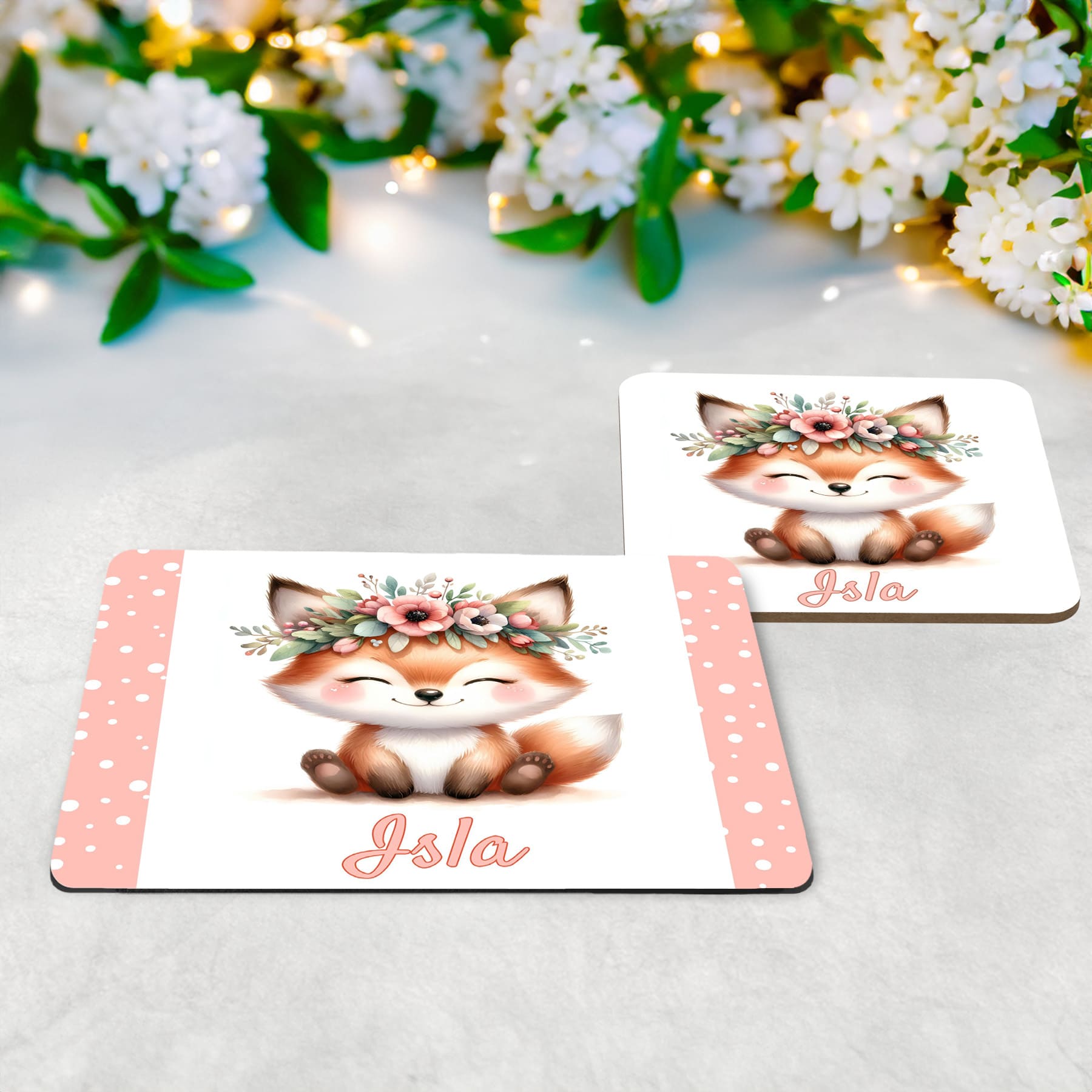 White placemat and coaster set with cute woodland fox wearing a flower crown. Personalised with your childs name in pale pink