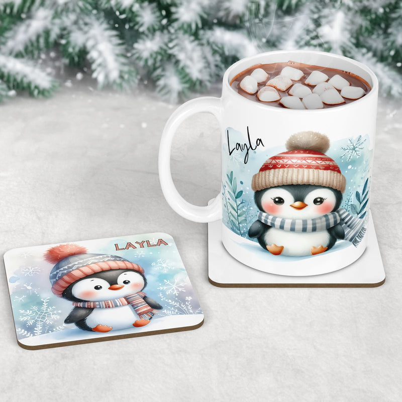 Personalised Mug, Coaster and Placemat set for Childrens Christmas. Featuring soft, adorable penguins dressed in hats and scarves and customised with childrens name
