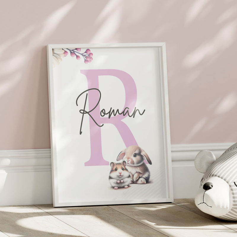 Set of three A4 prints featuring cute pets - puppy, kitten, rabbit, and hamster. The animals are depicted in a cute style resembling coloured pencil drawings. Simple flowers decorate the edges of the prints. The middle print features a smaller animal than the others, with a large initial letter in the background. A personalised name in black overlays the initial letter.