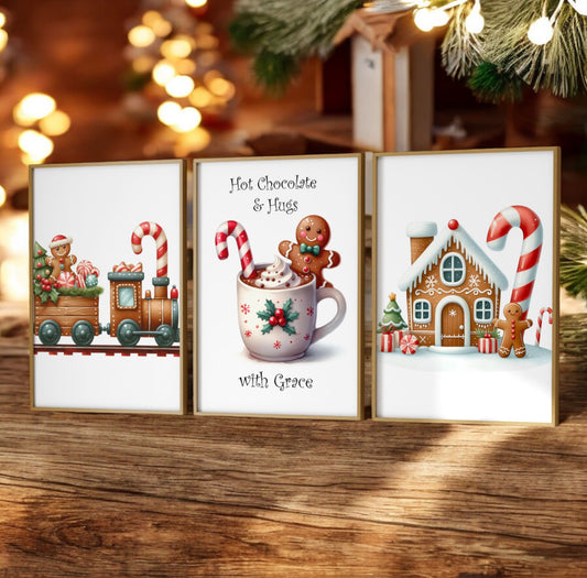 Trio of Childrens Christmas Prints. One with a  Gingerbread Train, one gingerbread house, and another hot chocolate with gingerbread man, reading "Hot Chocolate & Hugs" and personalised with childs name