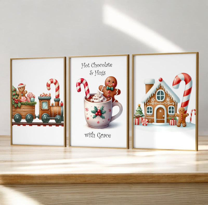 Trio of Childrens Christmas Prints. One with a  Gingerbread Train, one gingerbread house, and another hot chocolate with gingerbread man, reading "Hot Chocolate & Hugs" and personalised with childs name