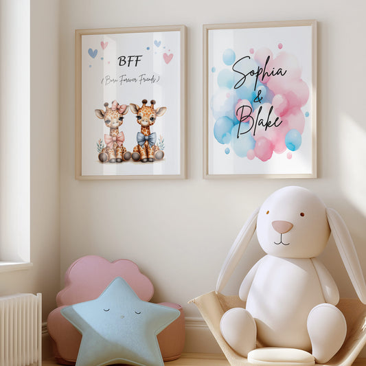 Set of 2 personalised prints for twins' nursery décor. One print features twin giraffes, one wearing a pink bow and the other wearing a blue bow. The prints also include watercolour splashes with children's names in bold black lettering.