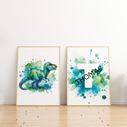 Set of 2 green/blue prints for children's nursery décor. One print feature vibrant, green/blue dinosaur in watercolour effects, while the second showcases watercolour splashes with a white initial letter and personalised black name