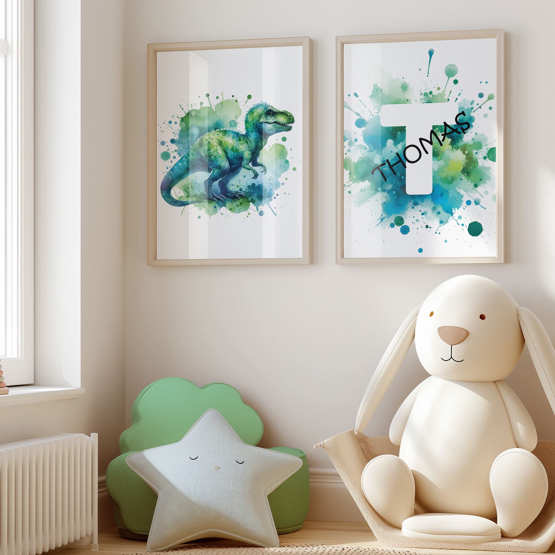 Set of 2 green/blue prints for children's nursery décor. One print feature vibrant, green/blue dinosaur in watercolour effects, while the second showcases watercolour splashes with a white initial letter and personalised black name