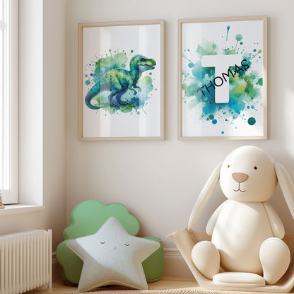 Set of 2 green/blue prints for children's nursery décor. One print feature vibrant, green/blue dinosaur in watercolour effects, while the second showcases watercolour splashes with a white initial letter and personalised black name