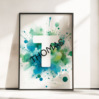 Set of 2 green/blue prints for children's nursery décor. One print feature vibrant, green/blue dinosaur in watercolour effects, while the second showcases watercolour splashes with a white initial letter and personalised black name