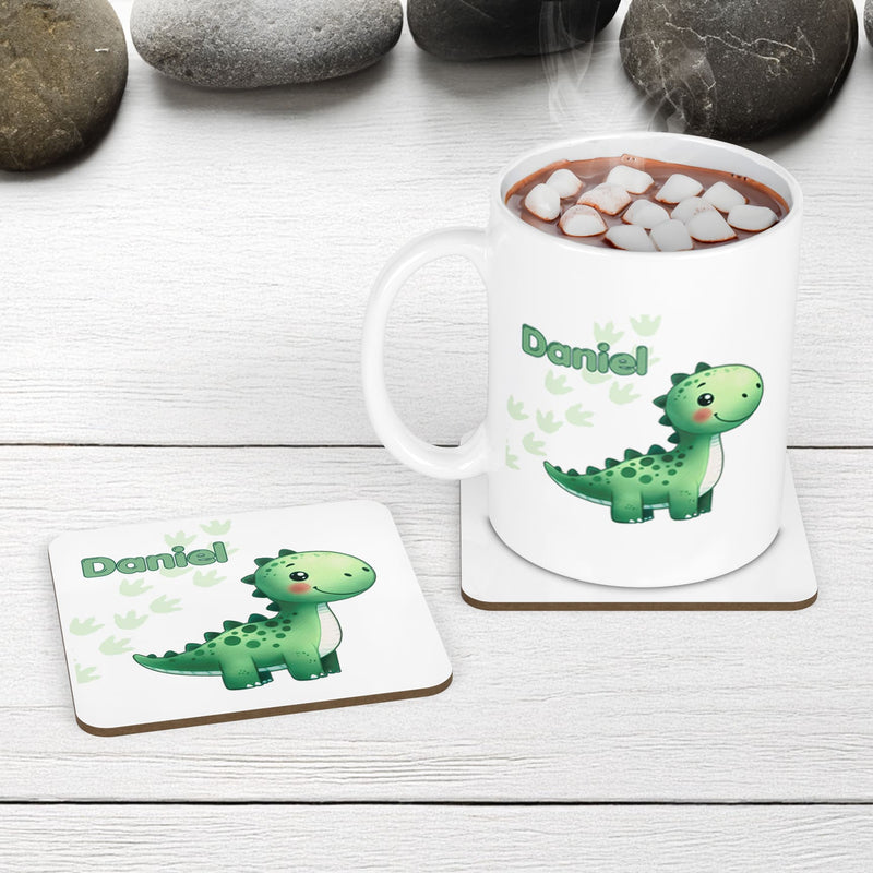 White Mug and Coaster Set with cute playful green dinosaur design with plants and dinosaur prints. Personalised with Childs name