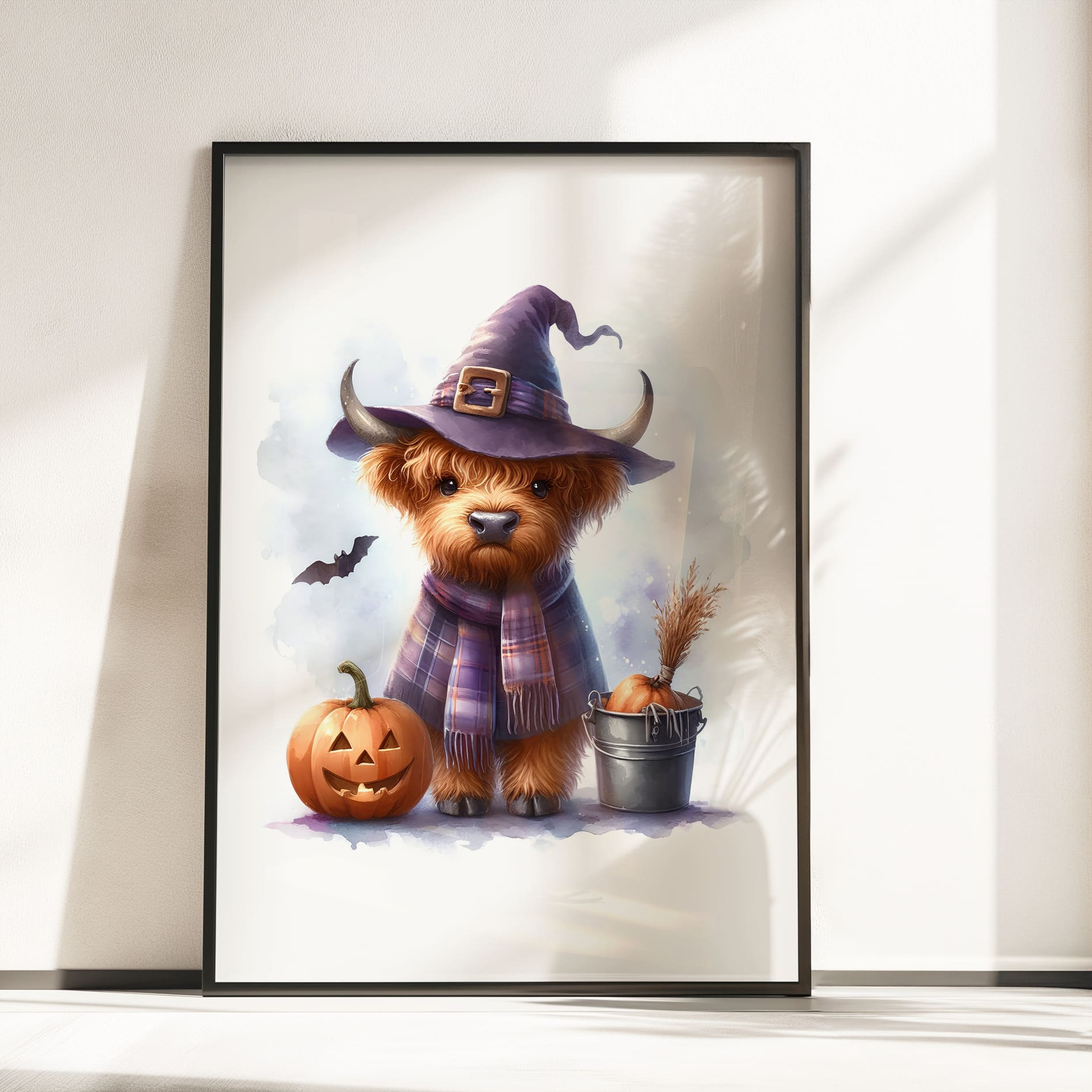 Three prints of cute Highland cows in Halloween costumes: one holding a pumpkin, one dressed as a witch, and one in a ghost sheet.