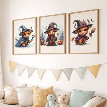 Three prints of cute Highland cows in witch costumes, holding magical props and pumpkins, perfect for Halloween nursery wall art.