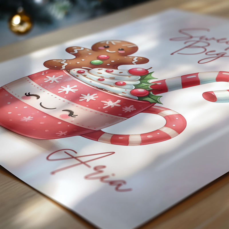 Cute Wall Print with a smily mug of hot chocolate with candy cane and gingerbread man. Quote read Sweet Dreams Begin Here and personalised with childs name