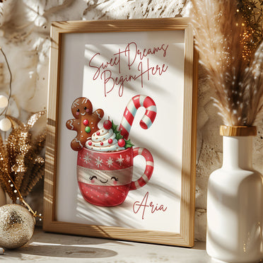 Cute Wall Print with a smily mug of hot chocolate with candy cane and gingerbread man. Quote read Sweet Dreams Begin Here and personalised with childs name