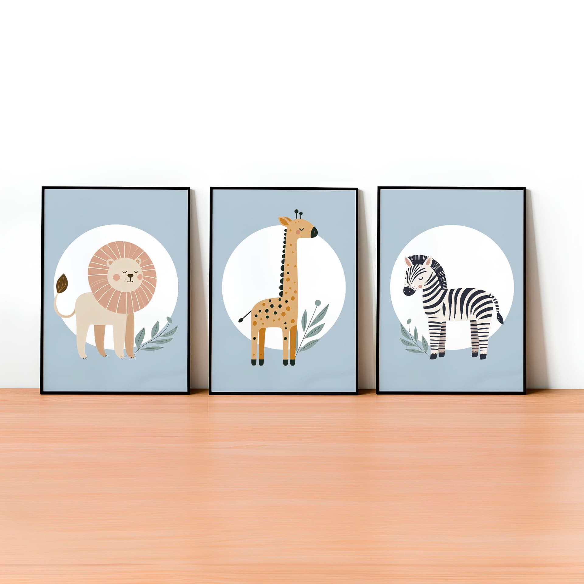 Set of three A4 prints featuring minimalist illustrations in muted tones. Each print depicts a different animal: a lion, a zebra, and a giraffe. The background is pale blue with a white circle on which the animal is overlaid.