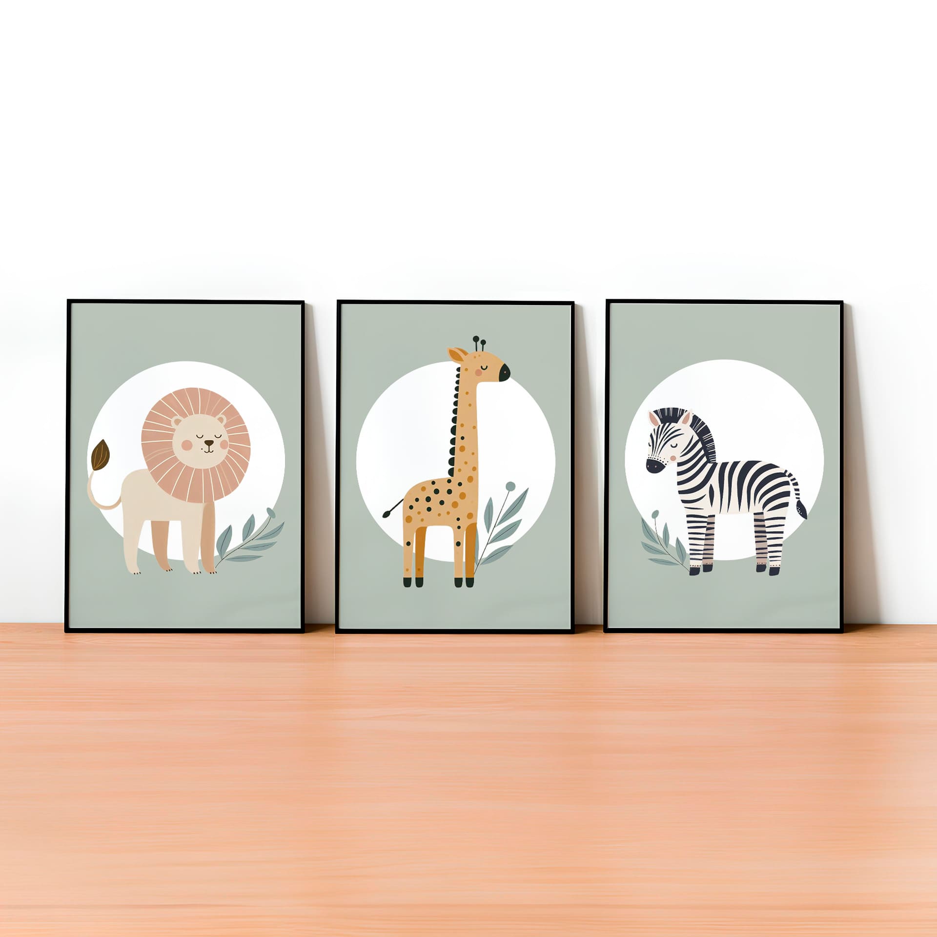 Set of three A4 prints featuring minimalist illustrations in muted tones. Each print depicts a different animal: a lion, a zebra, and a giraffe. The background is sage green with a white circle on which the animal is overlaid.