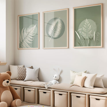 Three botanical nursery prints with white fern and leaf illustrations on soft green tones, featuring a stylish abstract circle for a unique, modern touch.