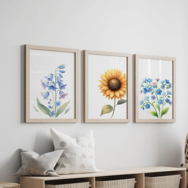 Three botanical prints with soft pastel illustrations of a sunflower, bluebell, and forget-me-not, perfect for a delicate, nature-inspired decor.