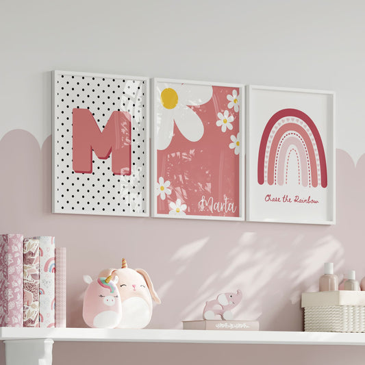 3 boho style nursery prints in shades of pink. One print with a boho pink rainbow, one with a spotty black and white background, and childs initial, one with daisys and childs name