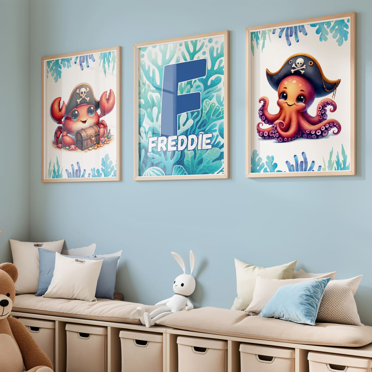 3 A4 nursery prints, one depicting a cute pirate crab with treasure, one with a cute pirate octopus and the other with bright blue seaweed background and personalised with childs initial and name overlaid