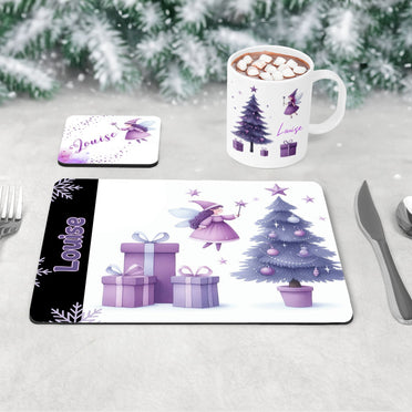 Childrens Christmas tablewear set. A mug, coaster and placement featuring christmas fairy designs in shades of purple. All personalised with childs name