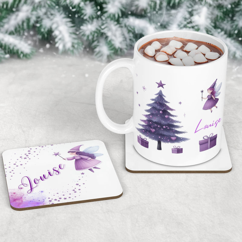 Childrens Christmas tablewear set. A mug, coaster and placement featuring christmas fairy designs in shades of purple. All personalised with childs name